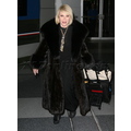 Joan And Melissa Rivers Arrive At JFK Airport In Fur